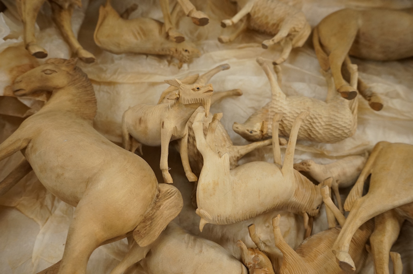 A collection of carved wood farm animals, largest 15.5cm